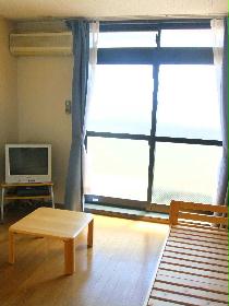 Living and room. There is also a room without furniture.