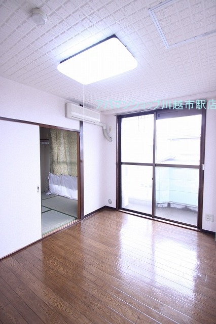 Living and room. ■ Indoor photo is a picture of another room