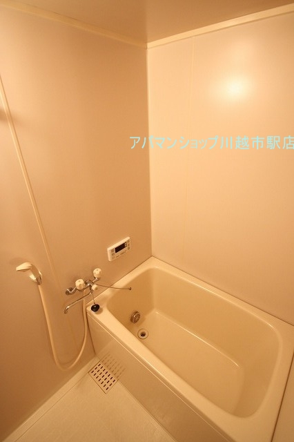 Bath. ■ Indoor photo is a picture of another room