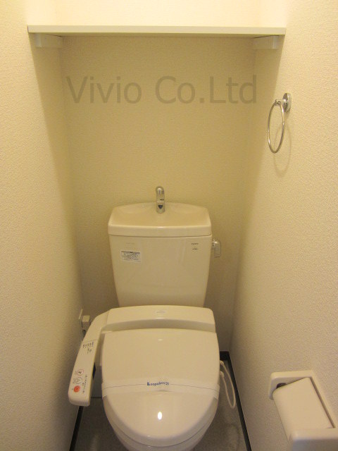 Toilet. It is with warm water washing toilet seat