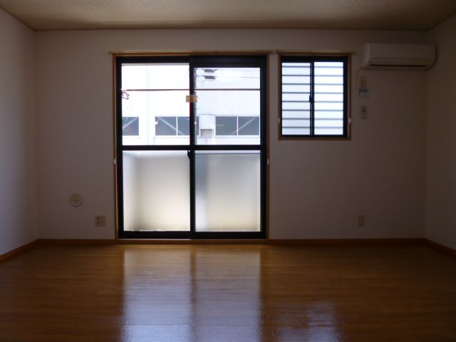 Living and room. I am happy there is a small window next to the large windows.