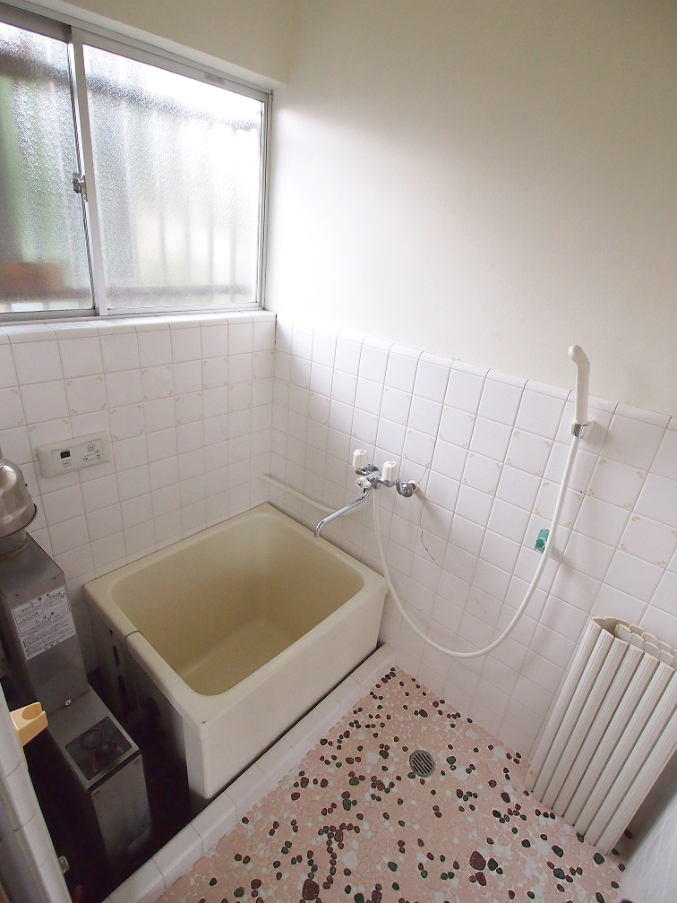 Bath. Bright bathroom with small window