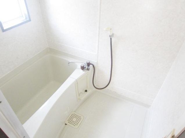 Bath. There is a small window in the bathroom