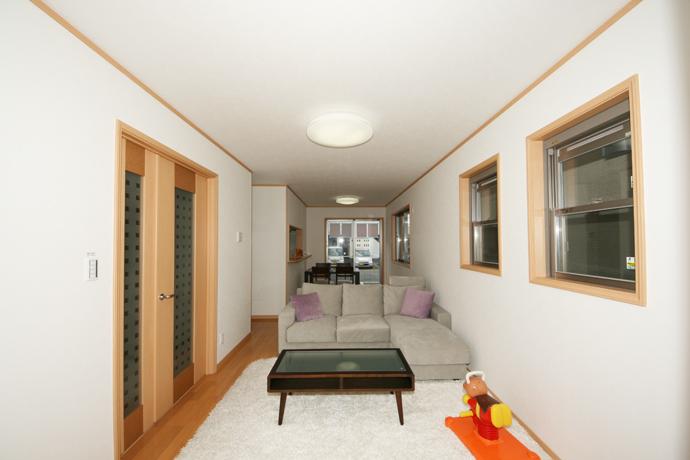 Living. You can make the dishes while watching the child and family. 