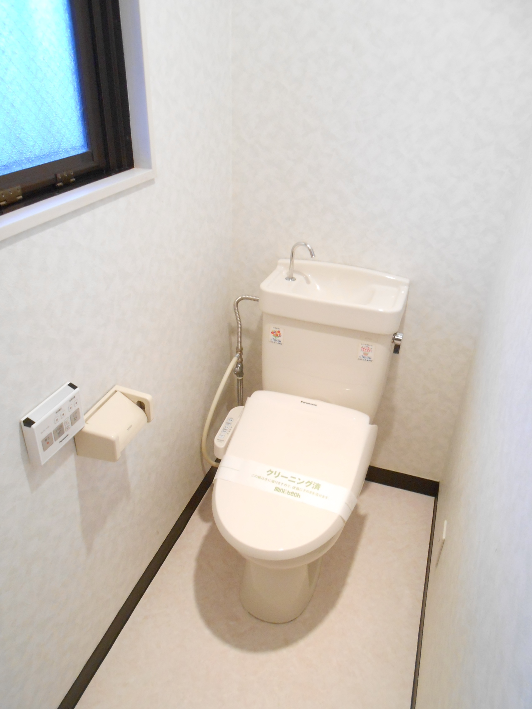 Toilet. The toilet has a window