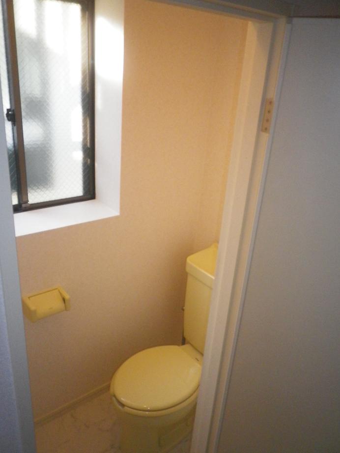 Toilet. There is a window in the toilet