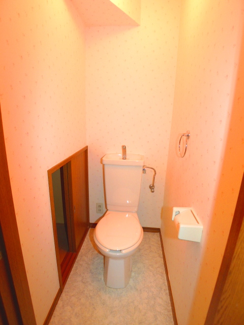 Toilet. It is a tile hanging with is happy in storage with