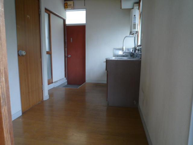 Living and room. There is also a window to the kitchen. 