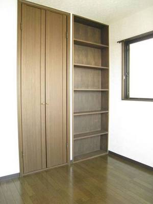 Living and room. With storage shelves at the entrance side of Western-style