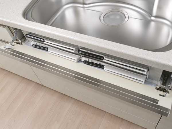 Kitchen.  [Smart pocket (With Child Lock)] Kitchen knife four is Maeru pocket housed in the sink before the panel portion. Since frequently used kitchen knife is in the easily accessible location of the hand, And taken out smoothly and Hakadori is mise en place.