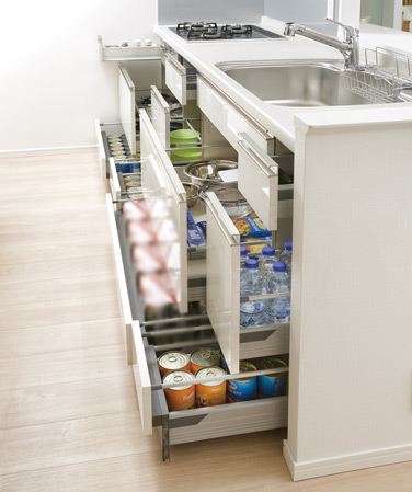 Kitchen.  [Sliding storage] Storage of system kitchens, It can be effectively utilized in the prone cabinet in a dead space, It has adopted a sliding storage.