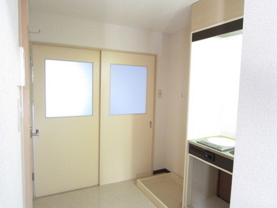 Kitchen. There is storage room washing machine