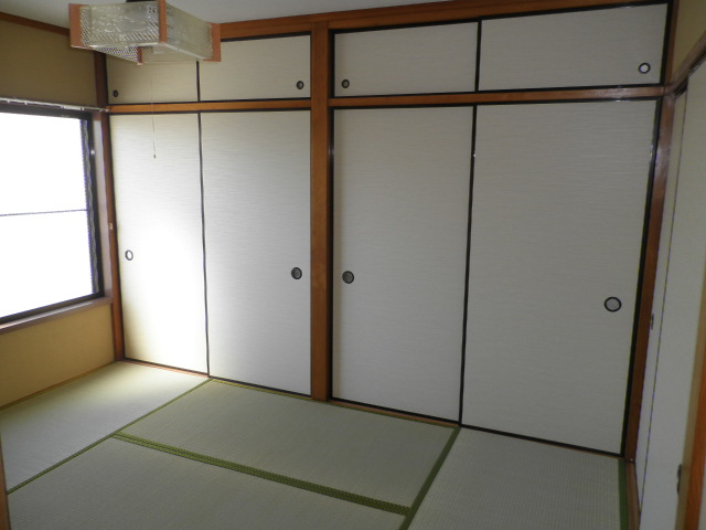 Living and room. Housed two between with upper closet