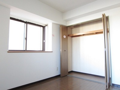 Living and room. It is the room bathed in light from the window