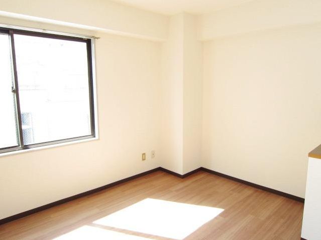 Other room space. Bright Western-style with a window.