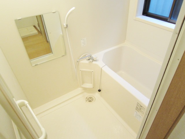 Bath. With a small window in the bathroom