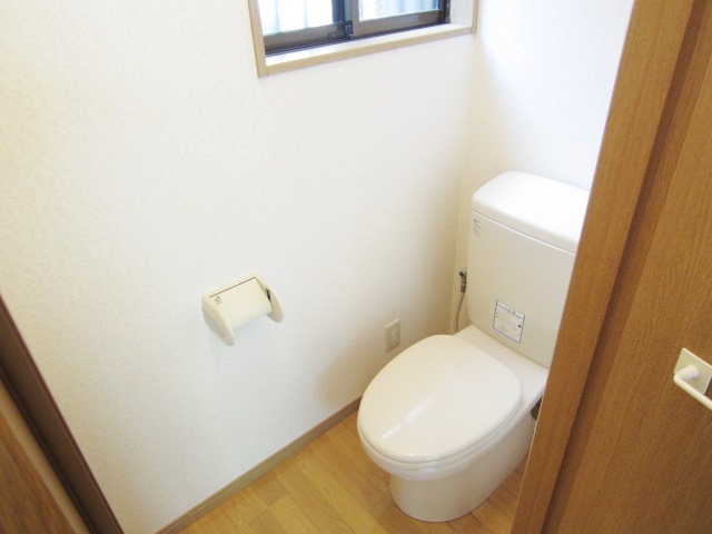 Toilet. There is a small window in the toilet