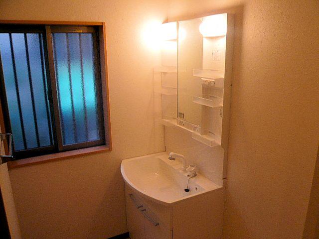 Wash basin, toilet. Vanity unit