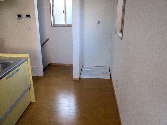 Kitchen. Living stairs and Laundry Area