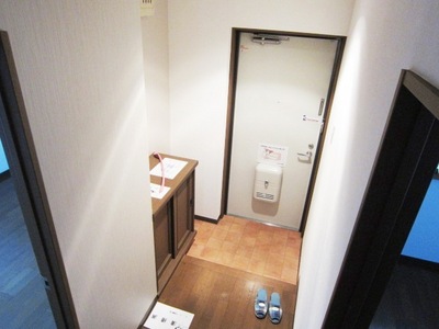 Entrance. There is a large shoe box