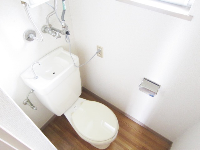 Toilet. There ventilation small window in the toilet