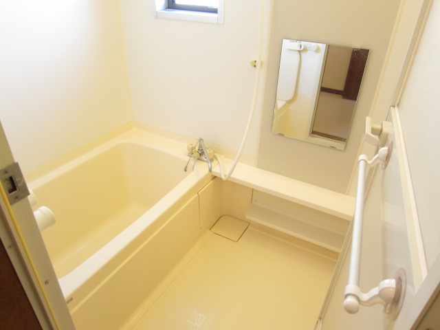 Bath. There is a small window in bathroom