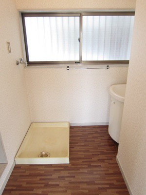 Washroom. It is a convenient washing machine inside the room to housework flow line