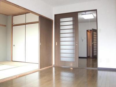Living and room. Sense of openness is felt by a sliding door