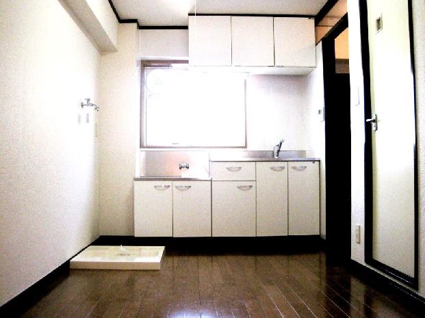 Kitchen. Washing machine in the room of the peace of mind on a rainy day