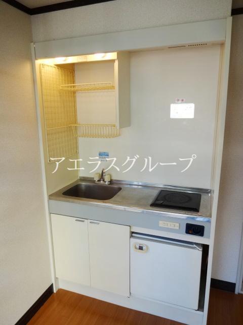 Kitchen. It is with a refrigerator