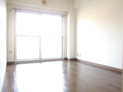 Living and room. This room facing the balcony