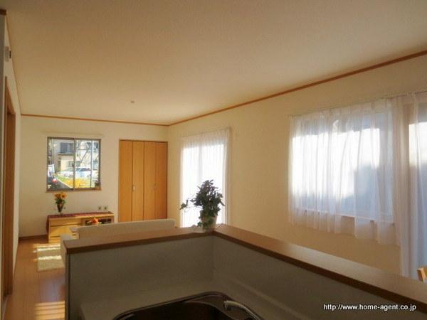 Living. Family of the face is visible, while the cuisine