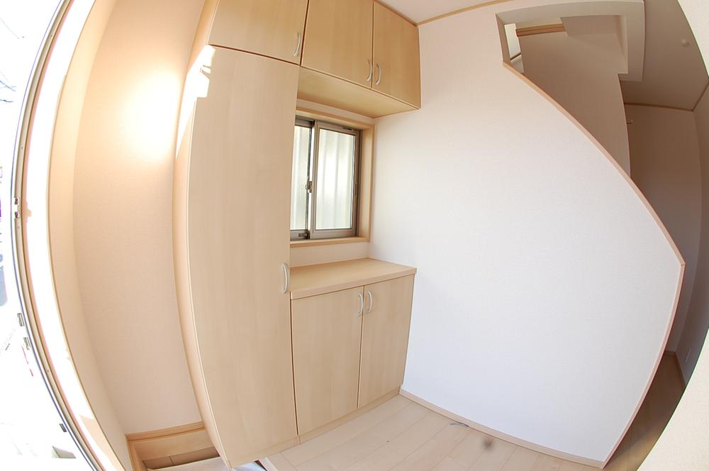 Entrance. Large front door storage