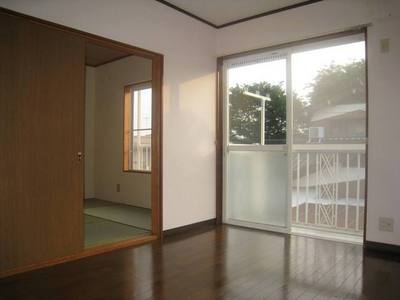 Living and room. It leads from Western-style to the veranda