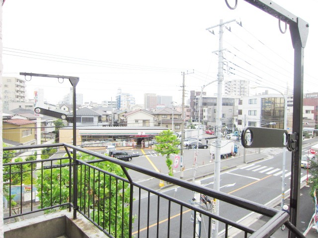 Balcony. There is a convenience store just across the road