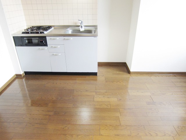 Living and room. Refrigerator yard in the kitchen next to