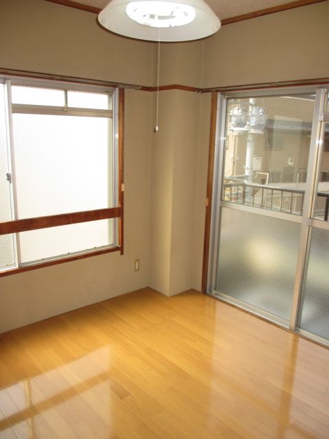 Living and room. Living room there is a window on two sides