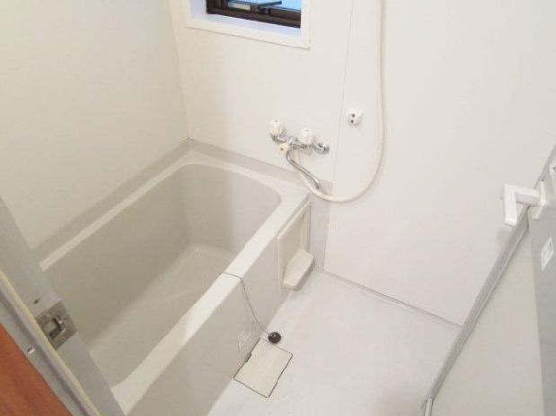 Bath. There is a window in the bathroom