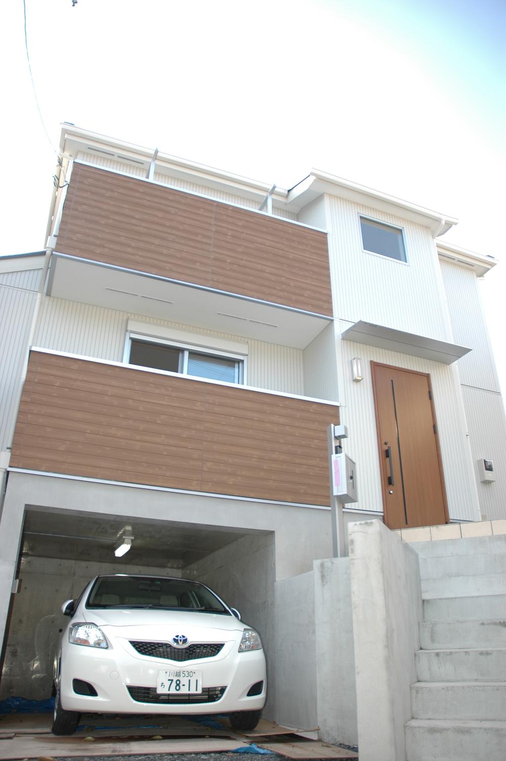 Local appearance photo. Local (12 May 2013) Shooting ・ First floor part is ordered and garage space. ・ We also now become popular modern design with respect to appearance.