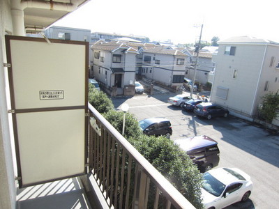 Balcony. In front parking lot! Day good