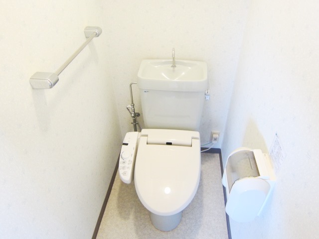 Toilet. Warm water cleaning toilet seat is a service goods