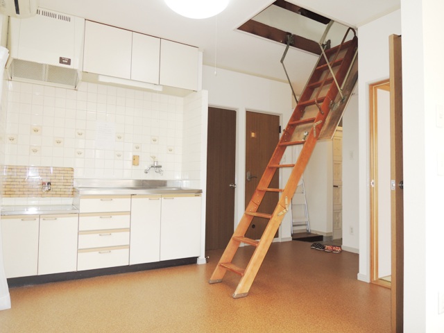 Living and room. There is a ladder to the attic