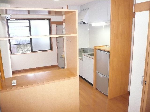 Living and room. It is with furniture.