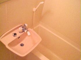 Bath. It is a clean bathroom that has been unified with white.