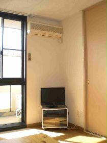 Living and room. Also it has a TV stand and TV.