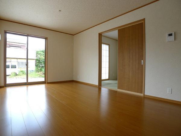 Living. 14 Building Living entering the bright sunshine