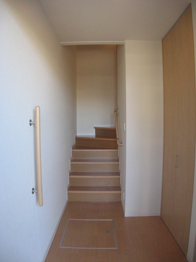 Entrance. Also has a foyer space is a handrail