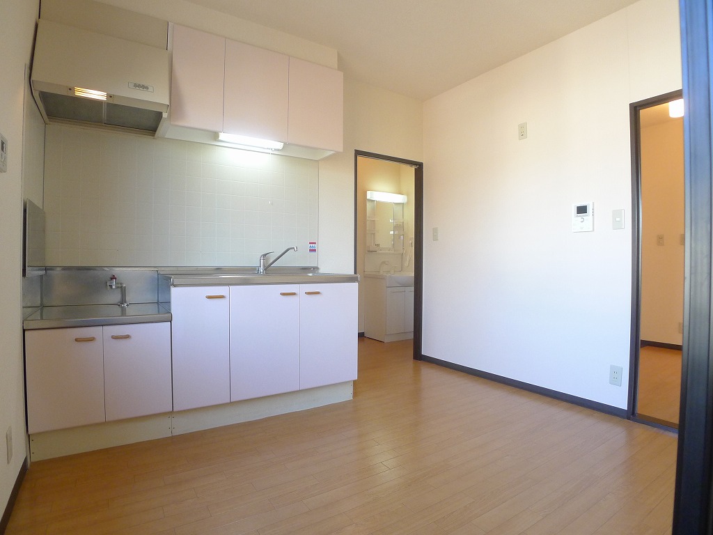 Living and room. Next to the kitchen there is a window that can ventilation