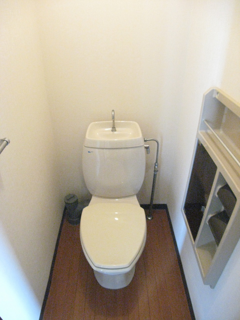 Toilet. It comes with a rack of convenient toilet paper