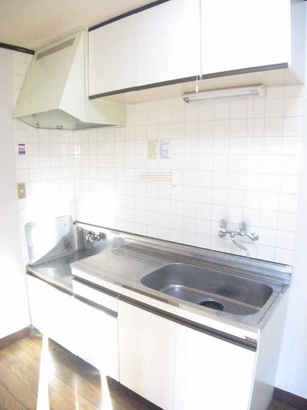 Kitchen. Because there is a hanging cupboard, Storage space enhancement